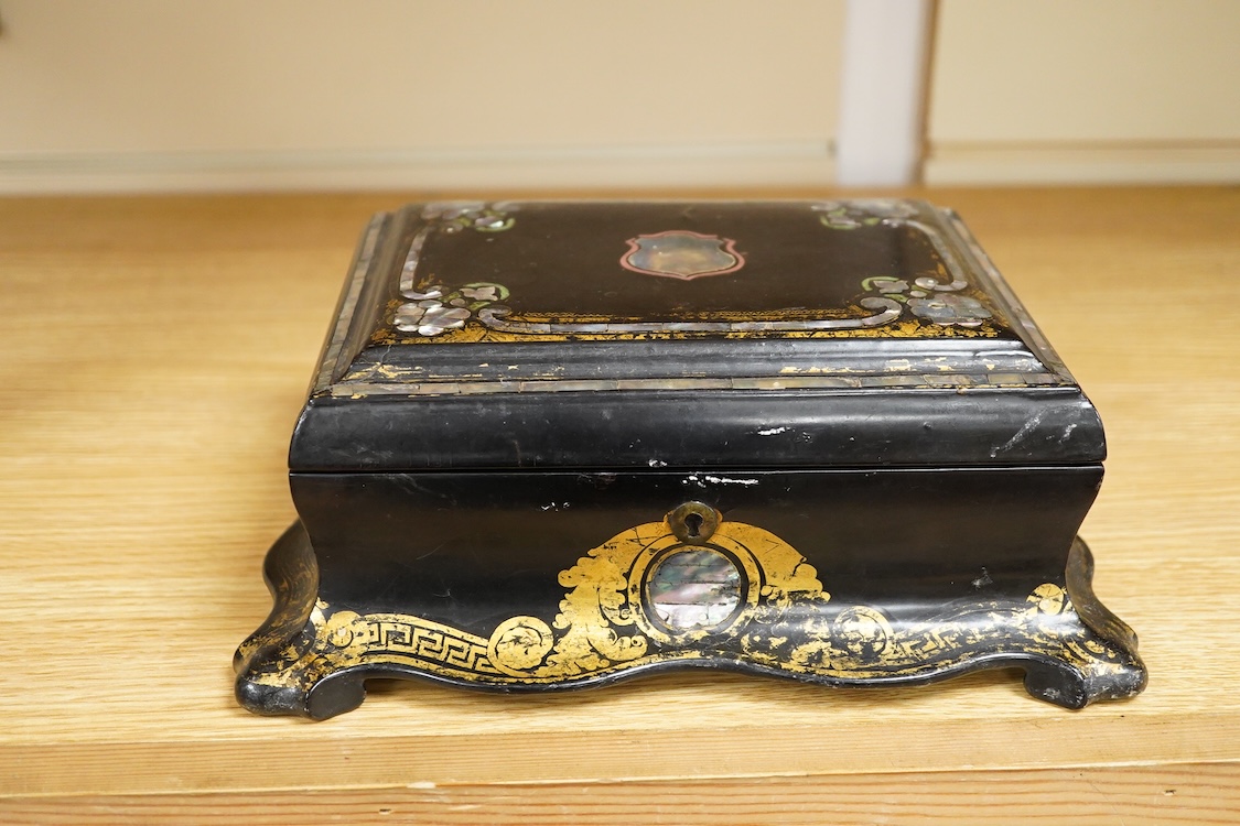 A Victorian papier maché jewellery box, abalone inlaid, 25cm wide